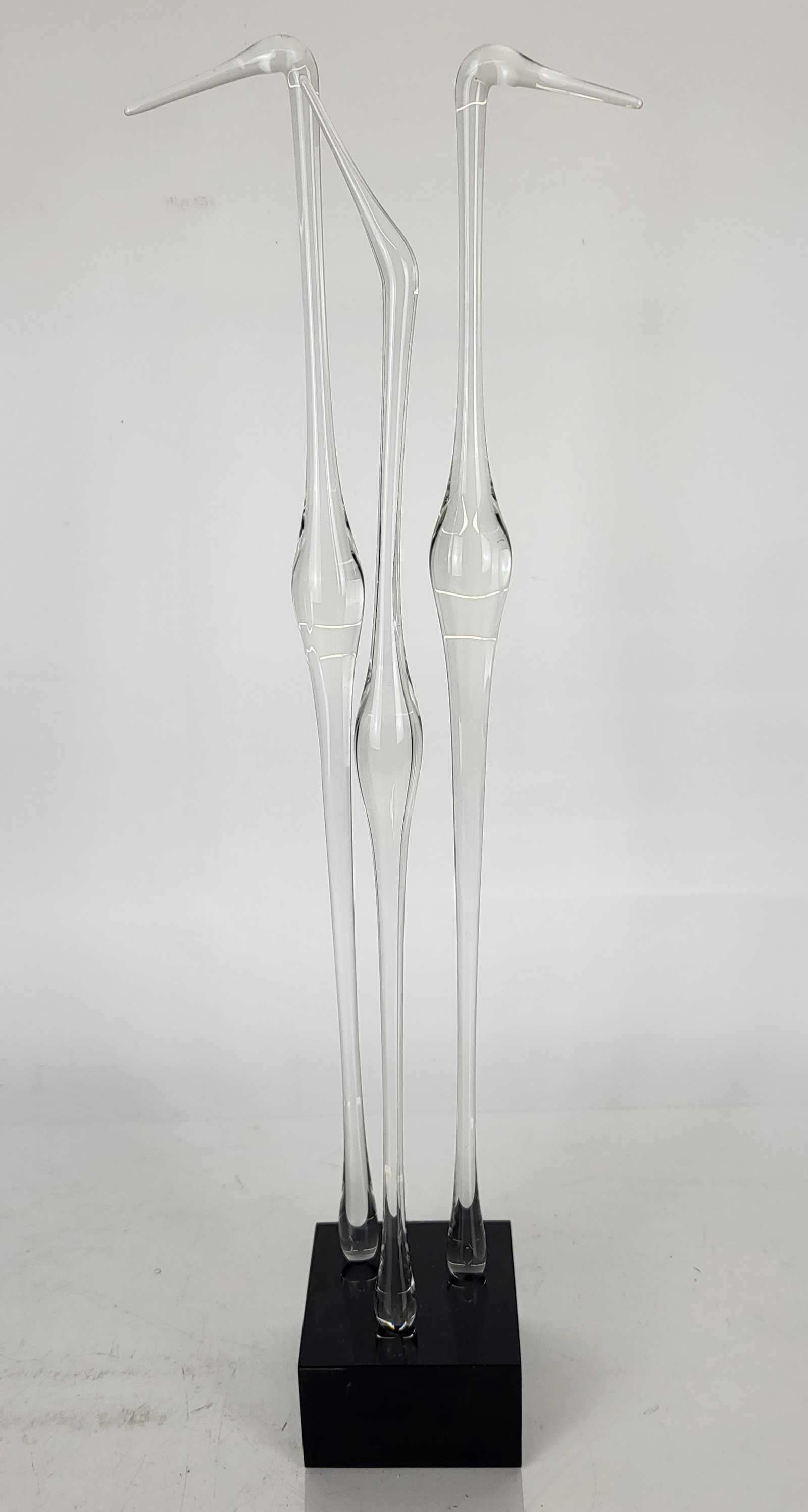 Guyol for Cartier Bird Sculpture: Guyol (Canadian, b. 1935) for Cartier sculpture of three glass cranes on a black base, signed to plinth side and top. [21 1/8" H x 3 1/2" W x 3 1/2" D]. Minor wear.