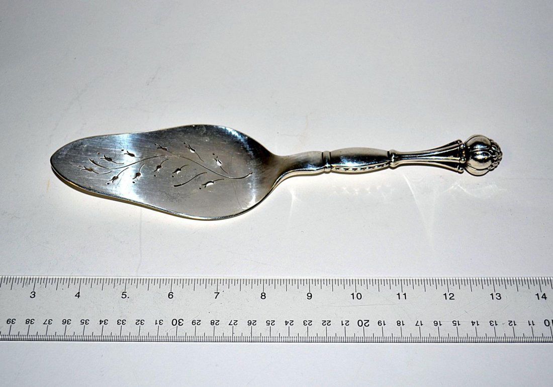Georg Jensen Sterling Silver Slice: Slice with pierced tulip design blade. Bears maker's mark and stamped with "38" style number. 10-1/2" long. 4.58 ozt.