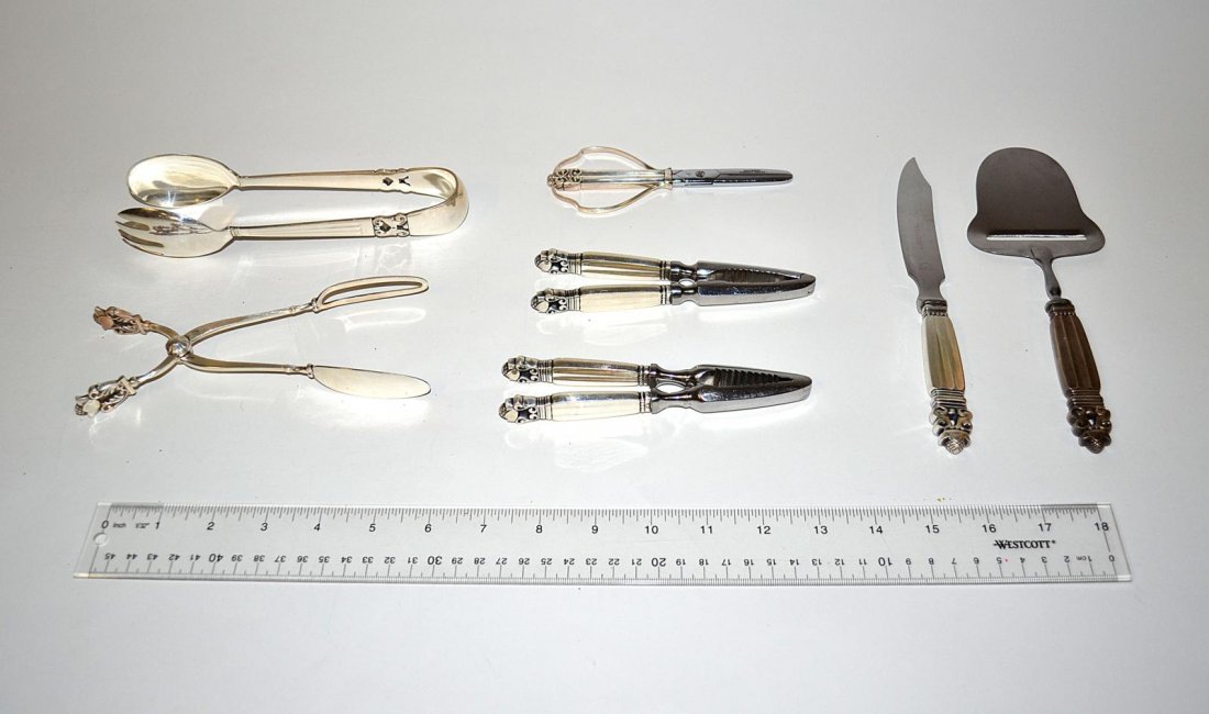 Group of 7 Jensen Sterling "Acorn" Serving Pieces: Comprises: two nutcrackers, cheese knife, cheese slice, scissors, toast tongs, and salad tongs. Total approximately 10 ozt. [weighable 6.86 ozt].