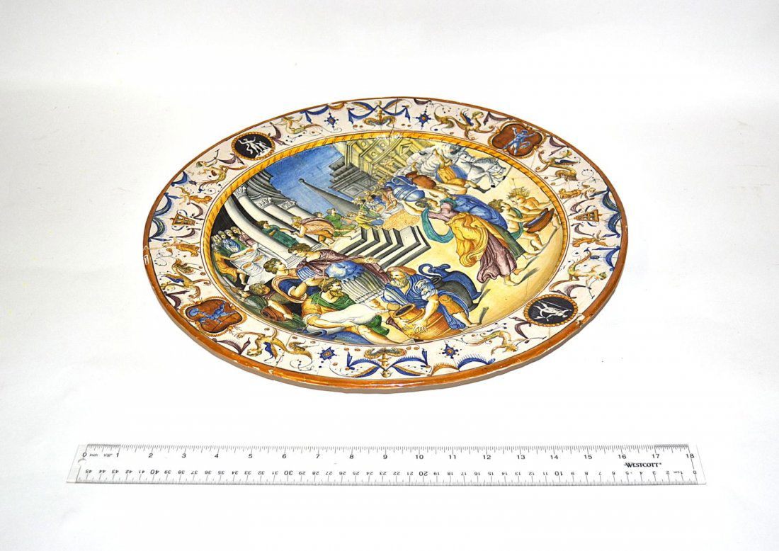 Antique Italian Charger: Scenic faience charger with decoration depicting people gathered at the market, repaired. 17" Dia.