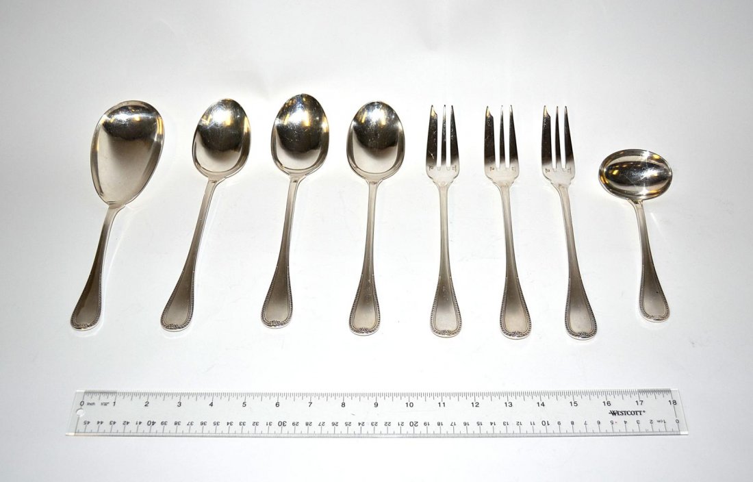 Christofle, France 8 Service Items: A pair of large spoons, a gravy spoon, soup spoon, ladle, and three salad forks by Christofle, France. 8 total. 7" - 9" L.