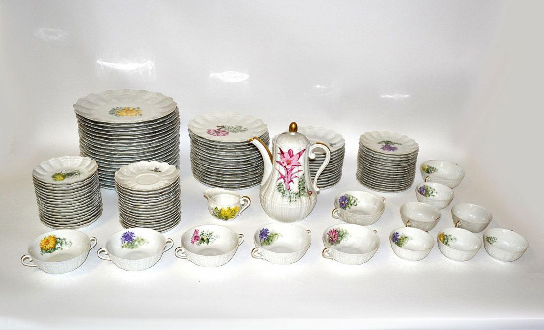 Limoges Porcelain Dinner Service [112 Pieces]: Comprises: 19 dinner plates, 16 cake plates, 17 bread & butter plates, 8 tea cups, 18 bouillon cups, 17 saucers, and 17 dessert dishes. Accompanied by a teapot and creamer. As a whole, in good conditi
