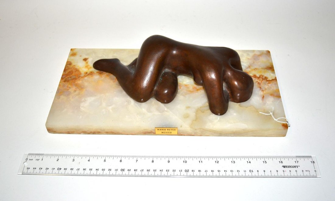Mario Reyes, Bronze Reclining Nude: Abstract reclining nude with torso turned downward. signed on figure's right shin: "M. Reyes." Mounted on a rectangular agate base. Overall: 15 3/4" x 8" x 4 1/8" H. In excellent condition.