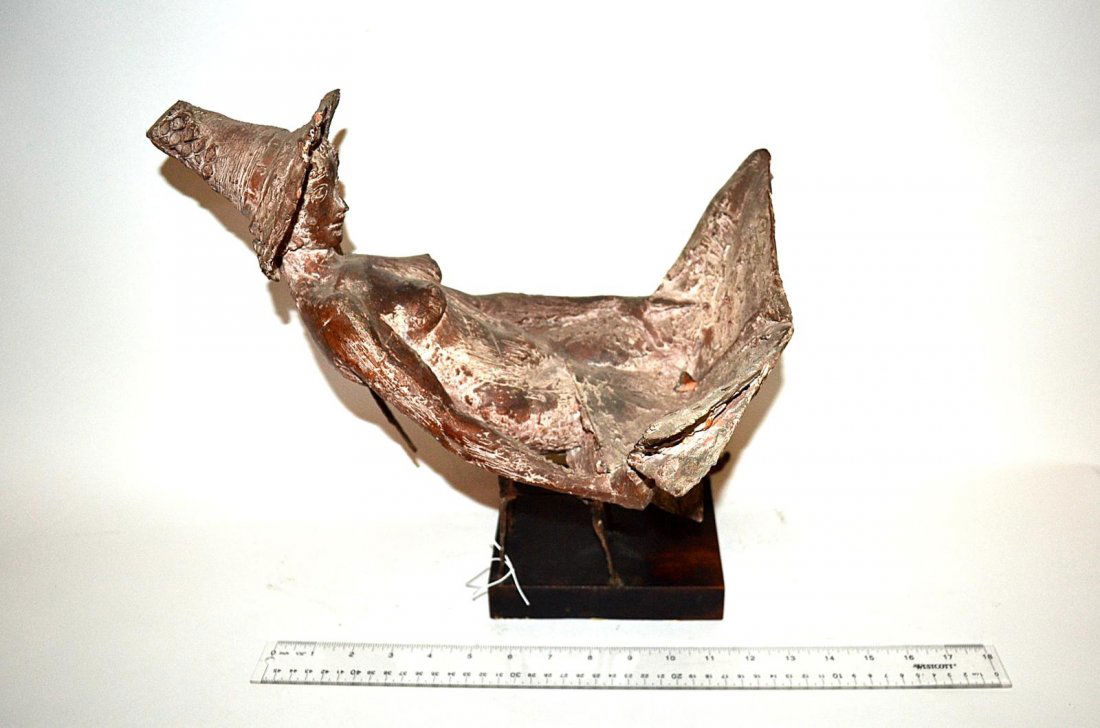 Bruno Lucchesi, Terracotta & Bronze Sculpture: A terracotta and bronze sculpture depicting a seated nude with a sun hut and newspaper, on base. Signed, "Lucchesi". 12" H x 15" L [without base]. In good condition. From the Estate of Arthur Laurents