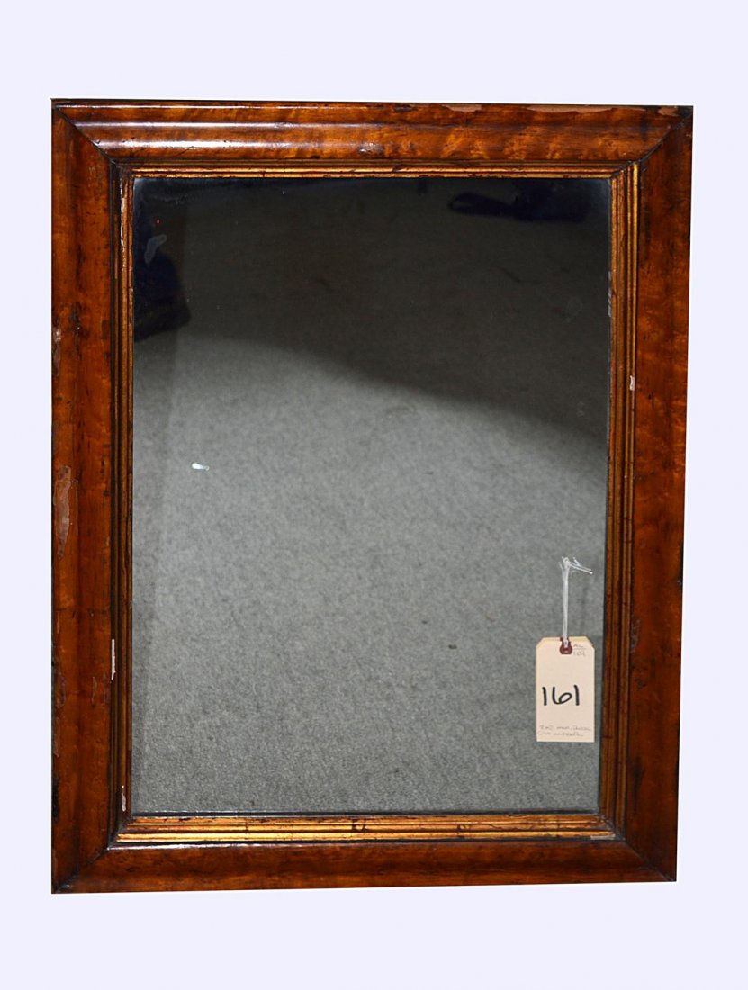 Empire Mahogany Parcel-Gilt Mirror: A French, 19th C. Empire mahogany parcel gilt mirror. Fair condition. From the Estate of Arthur Laurents.