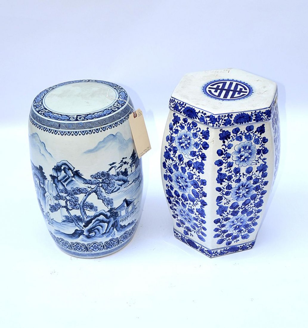 Two Blue & White Garden Seats: Two Chinese garden seats, one floral decorated, the other landscape and mountain decor. 17 1/2" - 18 1/2" x 10" - 11" Dia.