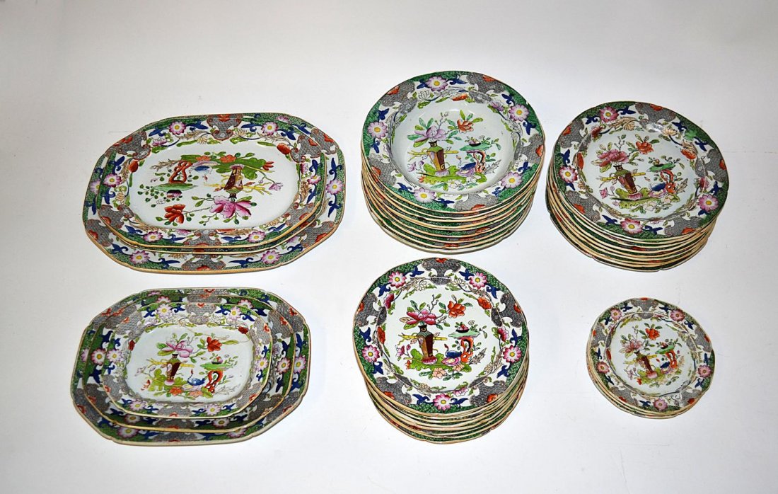 Masons Ironstone China, 38 pieces: Group of Chinoiserie decorated dinnerware including six platters, nine soup bowls, nine salad plates, ten dessert plates, and four saucers. Losses.