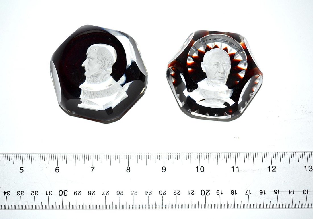 Two Baccarat Paperweights: Each depicting figures, both signed "Baccarat". One bears chips on base. From the Estate of Arthur Laurents.