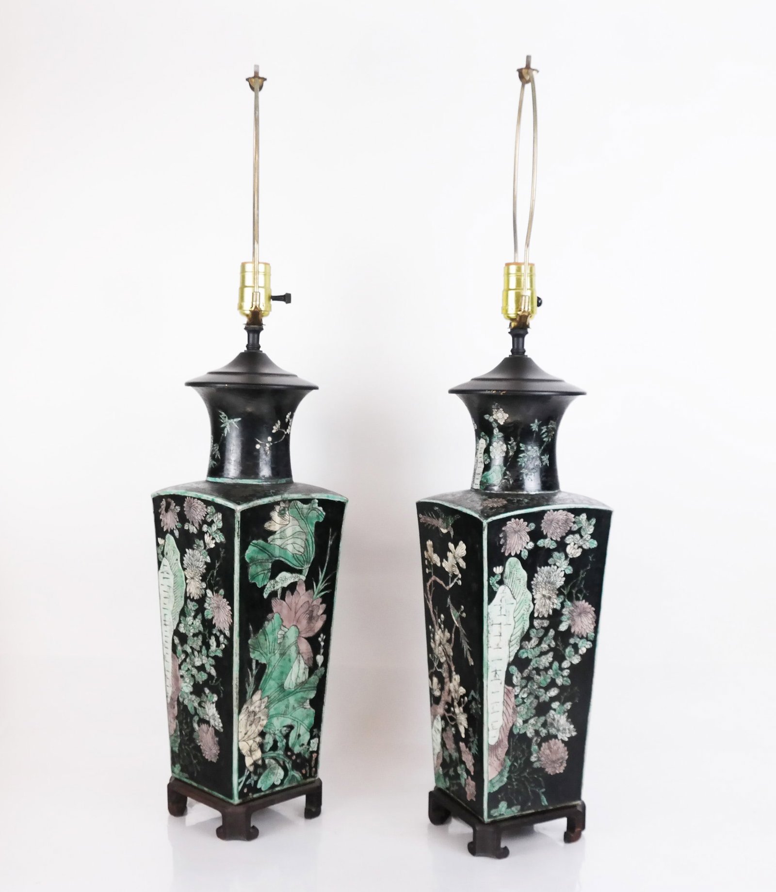 Pair of Chinese Famille Noire Vase Lamps: Pair of Chinese famille noire porcelain vase lamps decorated with flowering trees and birds. [31" H (to finial) x 6" W x 6" D]. One stand lacking foot; minor wear to decoration.