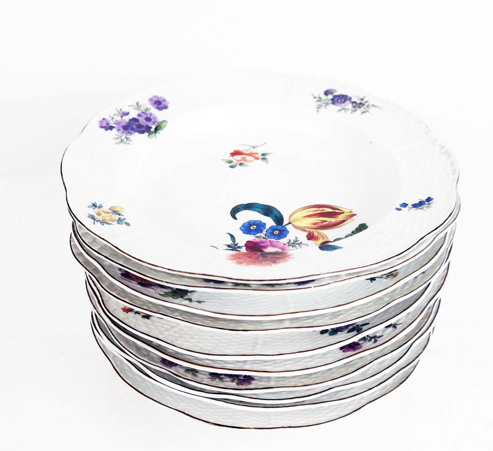 Herend Porcelain Soup Bowls (10): Ten Herend Hungarian porcelain soup bowls, circa 1900, in the "Printemps" pattern, with hand-painted Spring flowers. [9 1/8" Diam.]. Some rubbing and wear to decoration.