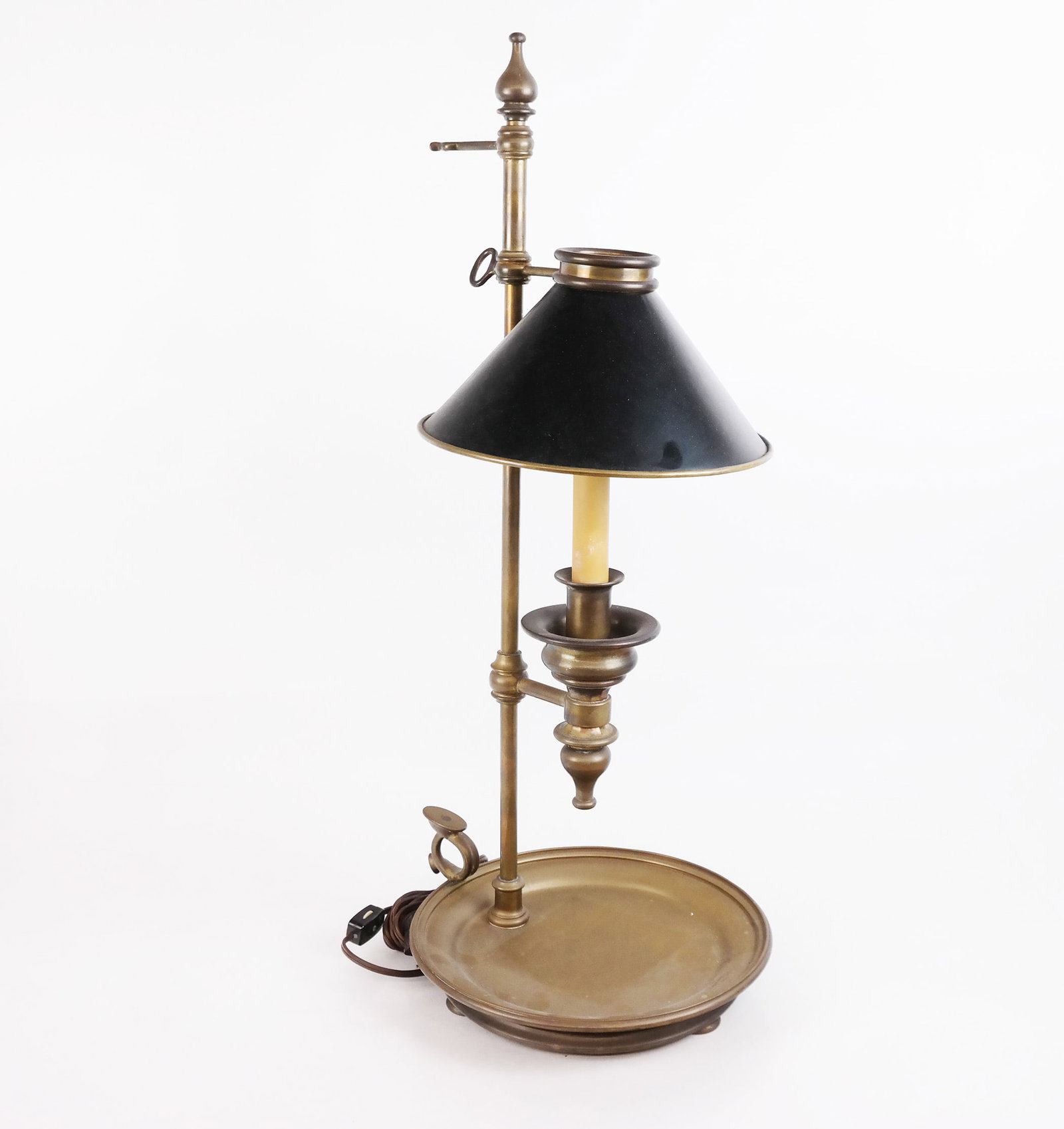 Antique Brass & Tole Lamp: Antique brass and tole lamp, early 20th century, with adjustable bouillotte-style shade over a round tray base. [26" H x 11" Diam.]. Oxidation, residue and marks.