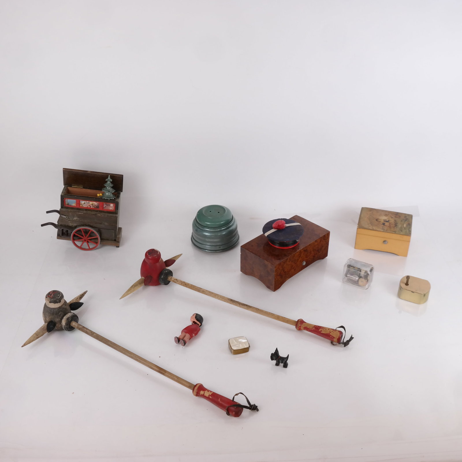 Assembled Group of Music Boxes & Toys (11): Assembled group of eleven (11) vintage music boxes and toys. [Largest: 3" H x 7 1/4" W x 4" D; Bull wand: 18" L]. Separations, losses, residue and wear.