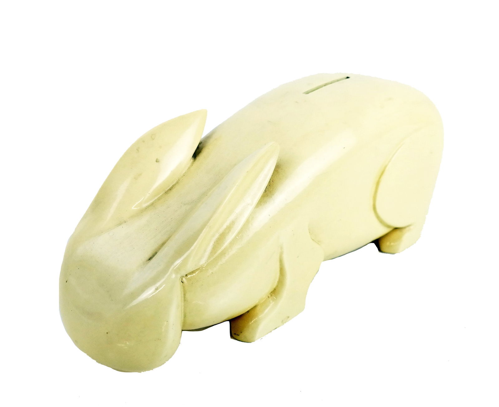Bakelite Rabbit-Form Bank: Bakelite rabbit-form bank. [4" H x 10 1/2" W x 3 1/2" D].