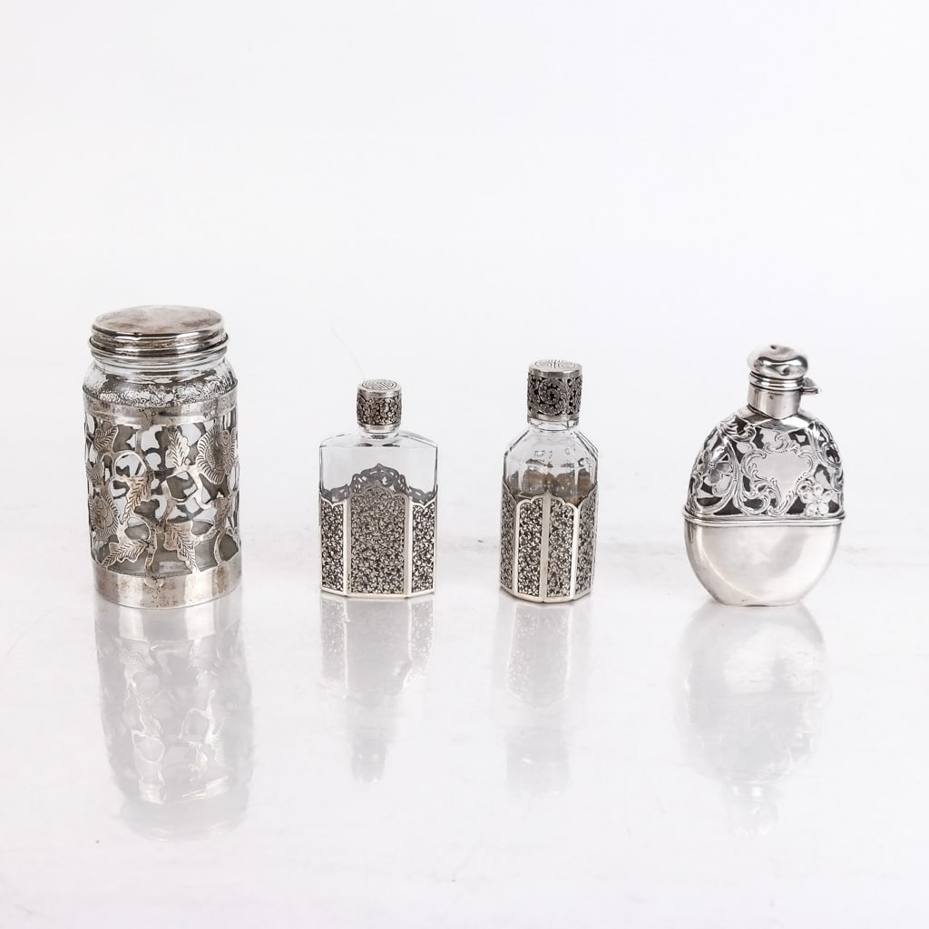Four (4) Silver-Mounted Glass Jars: Four silver-mounted glass jars, one from France. [Largest: 4 1/2" H x 2 1/2" Diam.].