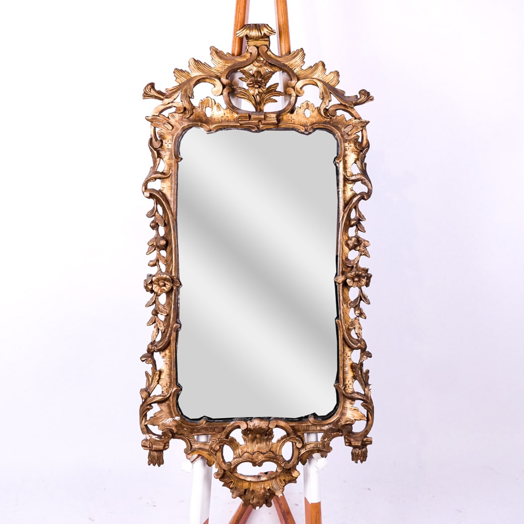 George III Carved Giltwood Mirror: George III carved giltwood mirror. [48" H x 25" W].
