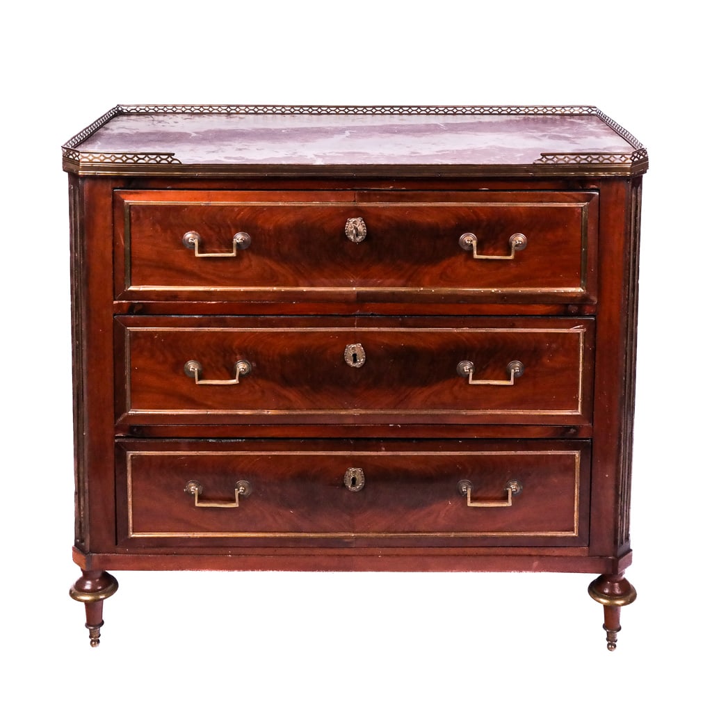 Louis XVI-Style Gilt Metal Mounted Commode: Louis XVI-style gilt metal-mounted commode, having a gallery above a rouge royale marble top with canted corners over a conforming case with three drawers. [35 1/2" H x 38" W x 18 1/2" D].
