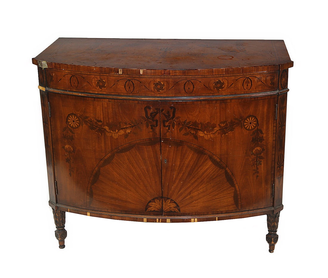 Custom Satinwood Inlaid Server: A custom satinwood server inlaid with garland and two sunburst doors opening to reveal three inside drawers, bearing metal plaque for "Royal Furniture Robert Irwin Co.". Circa 1950. [35" H x 41" W x 2