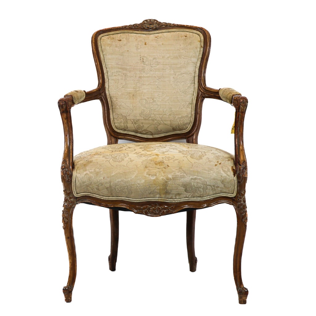 Antique Walnut Louis XV Armchair: Finely-stylized French-made antique fruitwood armchair.