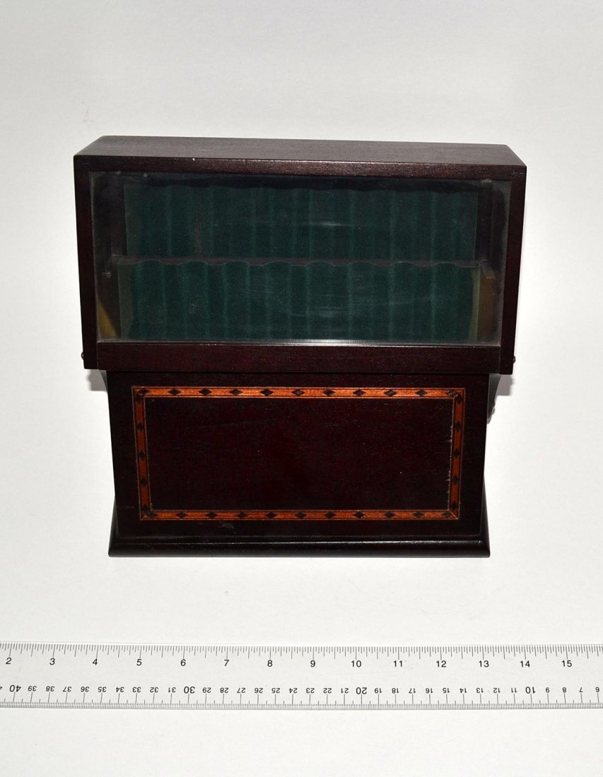 Inlaid Humidor: A mahogany inlaid humidor, having a pull-down glass lined door with a plaque "Levencer - Well Read Life". Good condition. 8 1/2" x 7" x 9".