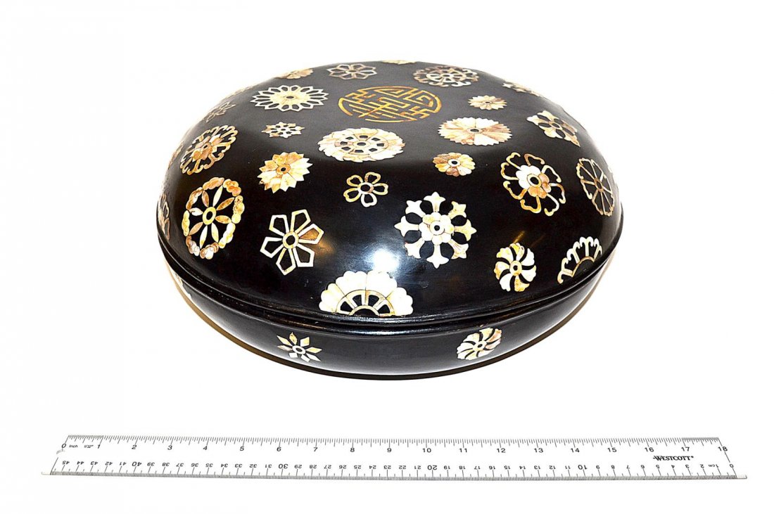Chinese Lacquered and Mother-of-Pearl Box: Circular box with multiple mother-of-pearl inlaid medallions. 15 1/4" diameter x 6 1/4 h. In good condition.