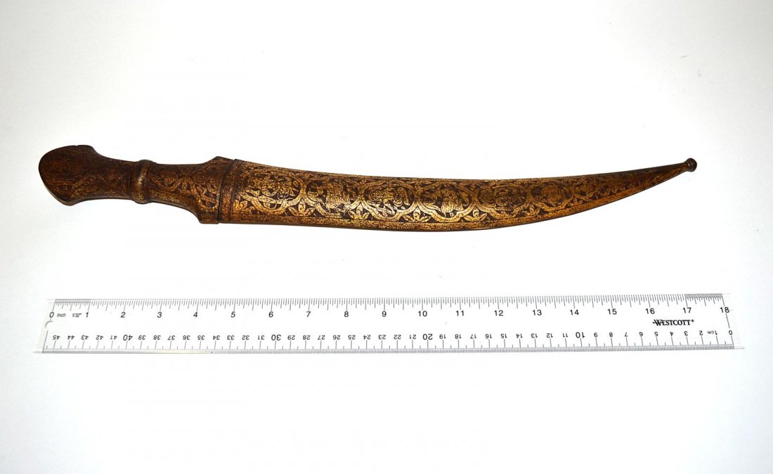 Indian Dagger: Dagger with curved blade and niello accents. Features figural decor on hilt and sheath. 19" long. Some oxidation, otherwise complete.