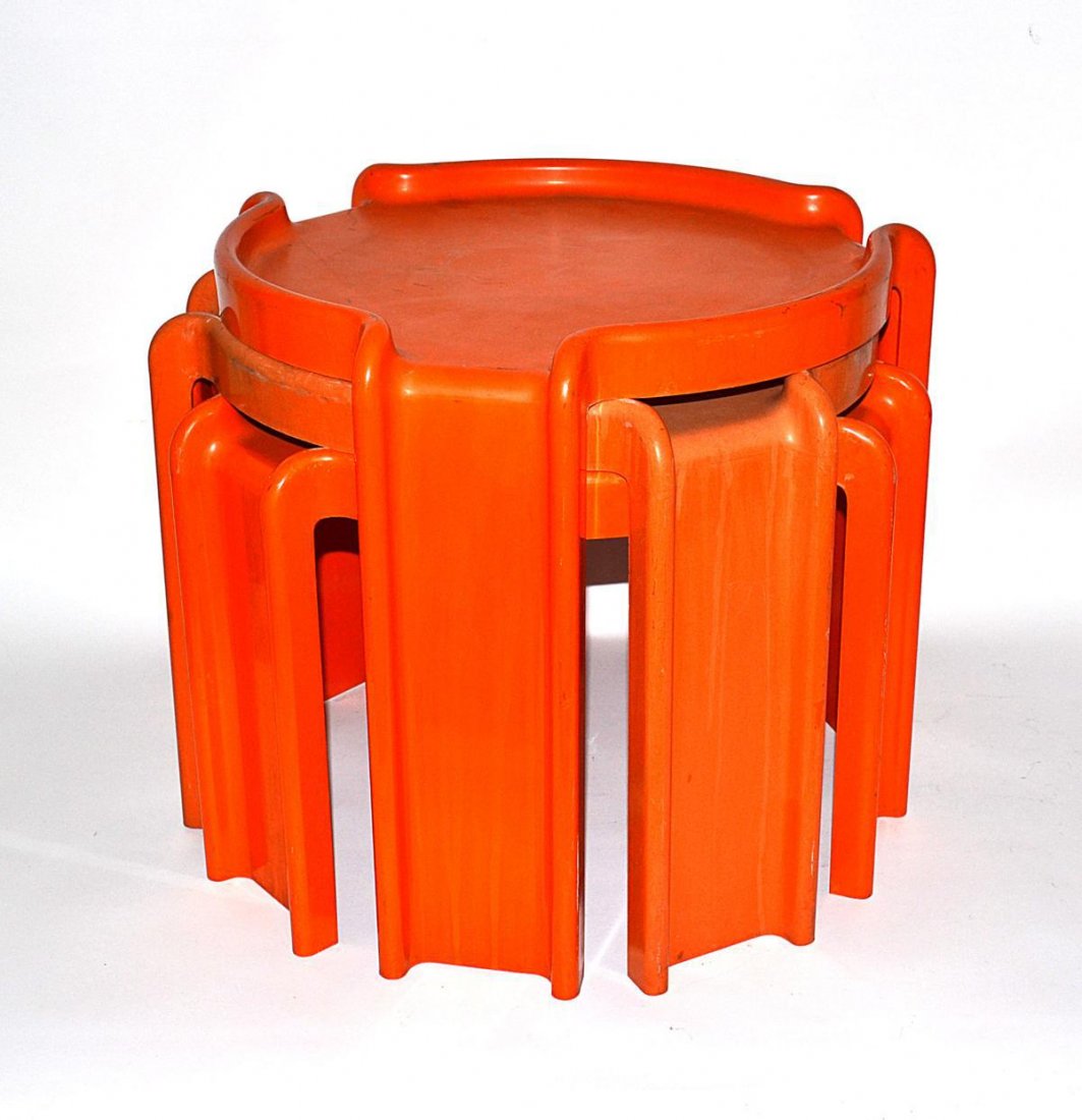 Three Artemide Orange Tables: Nest of three modern stack tables, orange molded plastic, by Artemide. Worn. 18 1/2"DIA x 16 1/2"H (each table).
