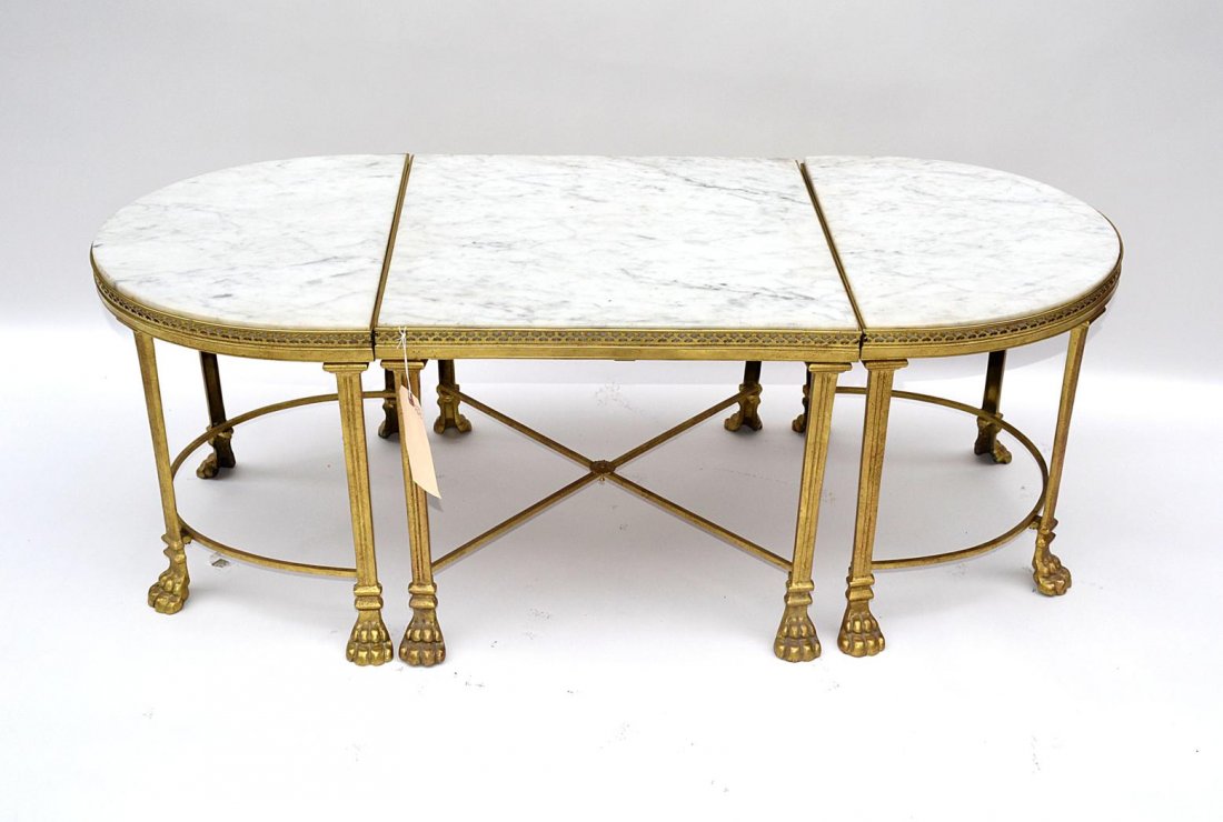 French Three-Part Bronze and Marble Cocktail Table: Circa 1950 cocktail table composed of a rectangular form at center flanked by two demilune ends. Bears a pierced gallery top and lion paw feet. Overall 48" x 20 1/4 x 17" h. In good condition.