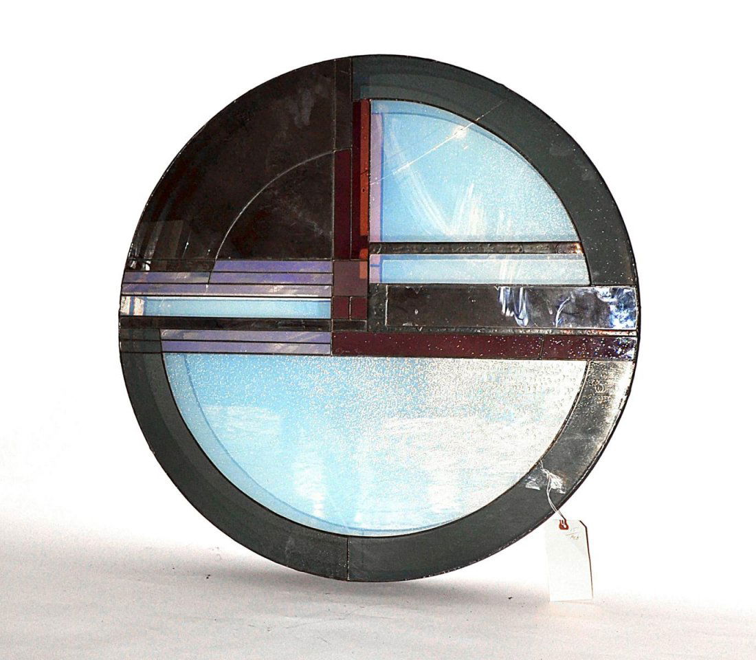 Contemporary Leaded Glass Wall Applique: Circular applique with geometric design. Signed illegibly at center. 30 1/4" dia x 3 1/8" deep. As is, bears two cracked elements.