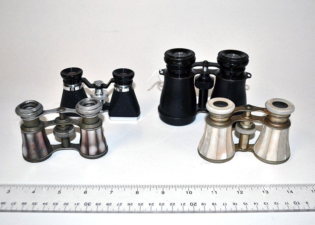 Four Pairs of Opera Glasses: Comprises German, Japanese and others. Vintage and modern. Two pairs are mother-of-pearl. Condition varies from fair to good.