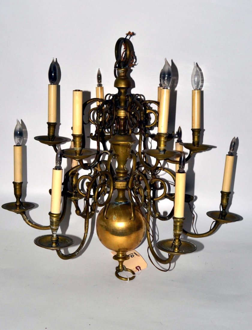Williamsburg Style Twelve Light Fixture: Brass twelve light fixture. Worn.