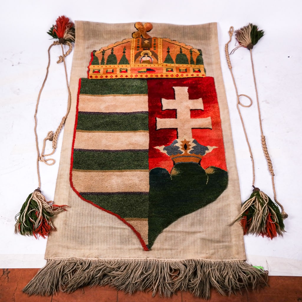 Hungarian Coat of Arms Wall Hanging: Hungarian coat of arms wall hanging, together with decorative passementerie tassel cords in complementary colors. [80" H (including fringe) x 40" W].