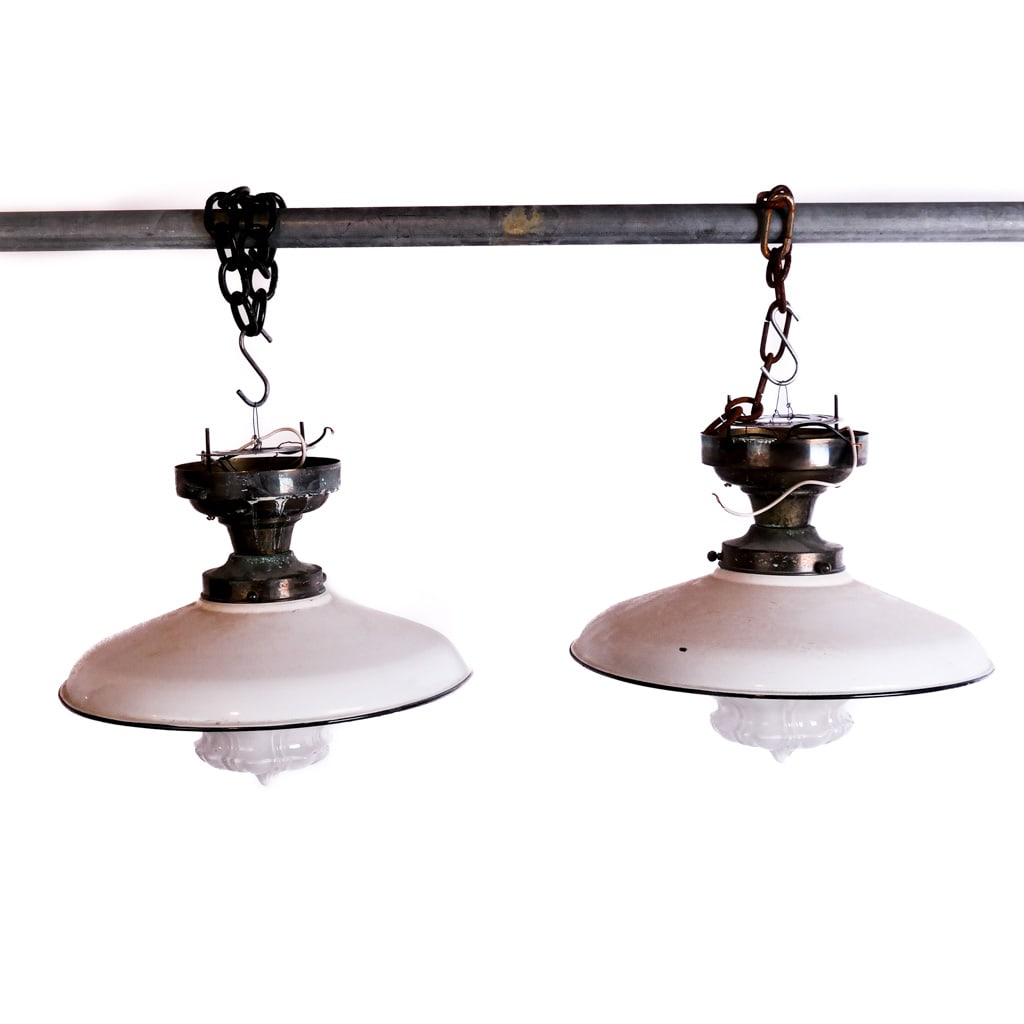 Pair of Vintage Enameled Metal Lanterns: Pair of vintage enameled metal schoolhouse lanterns, first half of the 20th century. [14 1/2" H x 15" Diam.]. Oxidation to brass tops; residue, losses and wear to decoration.