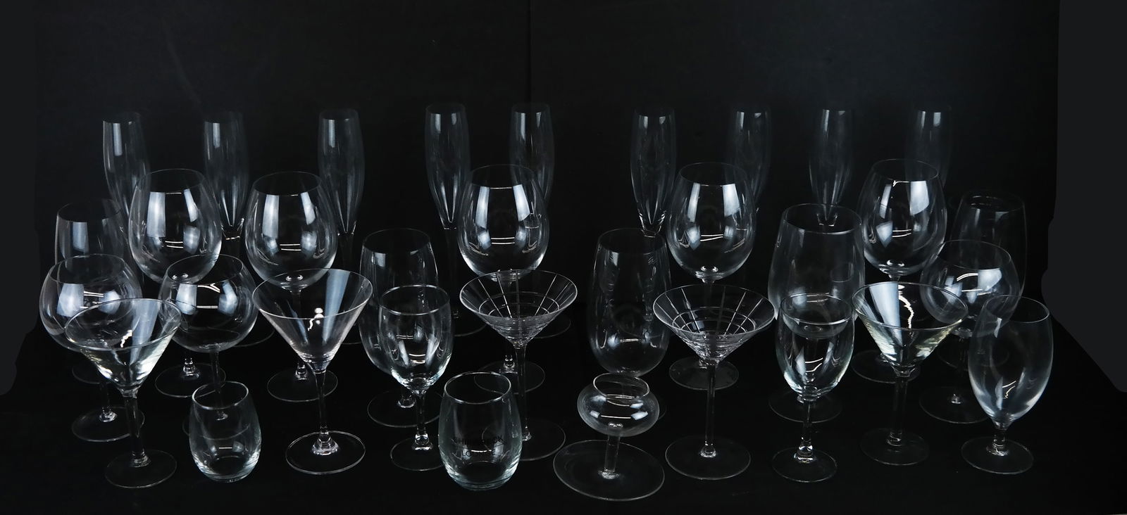 Group of Glass Stemware, Including Tiffany & Co.: Assembled group of glass stemware, including a pair of Tiffany & Co. martini glasses in the "Plaid" pattern, together with various unmarked goblets, champagne flutes, beer pokal, wine glasses and othe