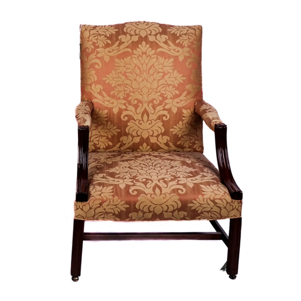 George III-Style Damask-Upholstered Lolling Chair: George III-style damask-upholstered lolling armchair on mahogany frame. [40 1/2" H x 27" W x 26" D]. In overall good condition with typical marks and wear.