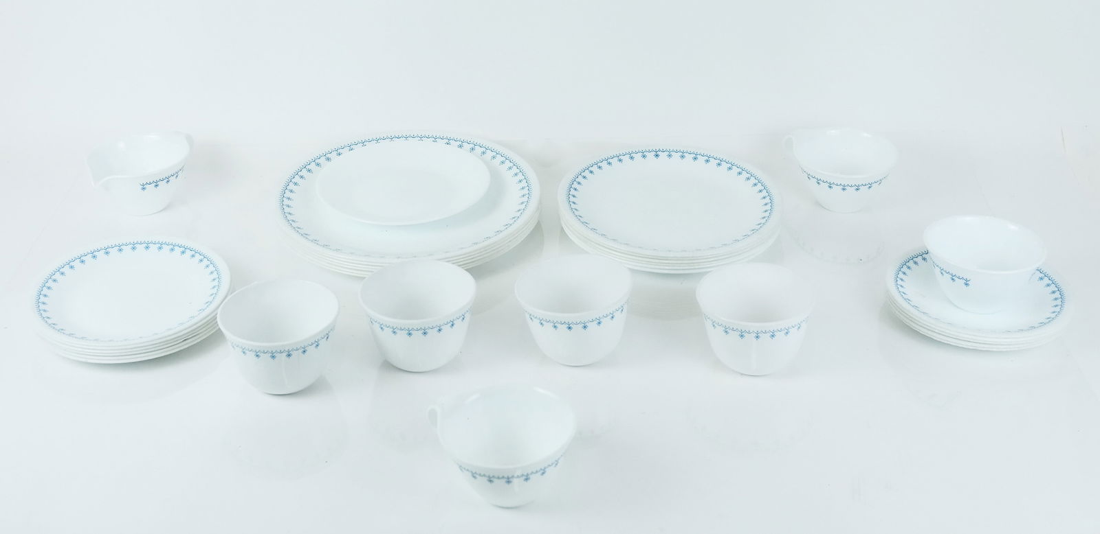 Corelle Partial Dinner Set: Corelle partial dinner set, comprising 6 each dinner plates, salad plates, side plates and cups, and 5 saucers.