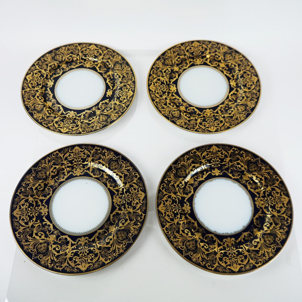 Set of 4 Limoges Bernardaud Plates: Set of four (4) Limoges Bernardaud place plates, having raised gilt trim on cobalt blue rims. [10 1/2" Diam.].