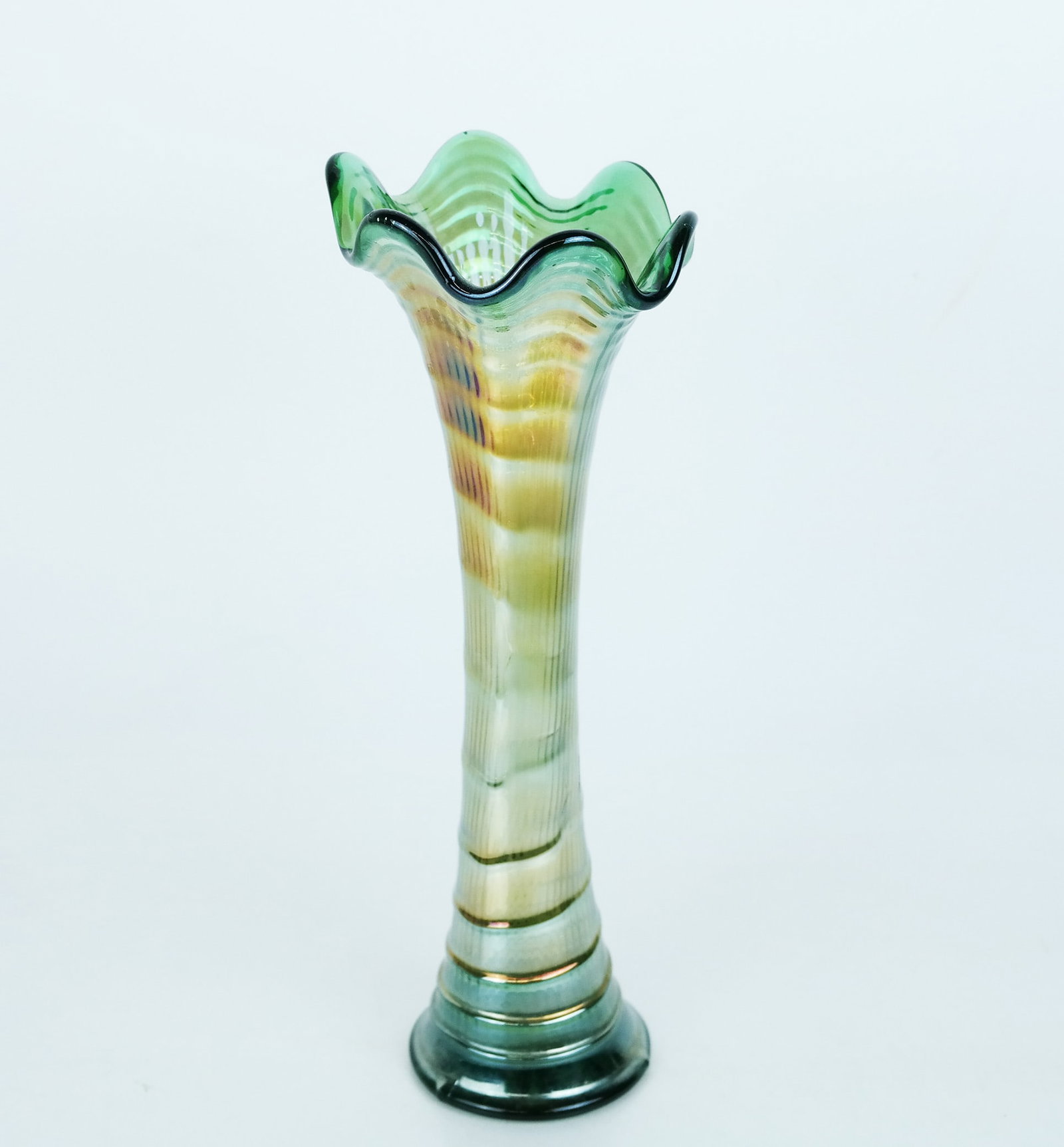 Tall Carnival / Depression Glass Funeral Vase: Tall Carnival / Depression glass funeral vase, early 20th century, having ruffled rim and wave details to the green iridescent vase, of trumpet form, in the manner of Northwood or Fenton, unmarked. Sm