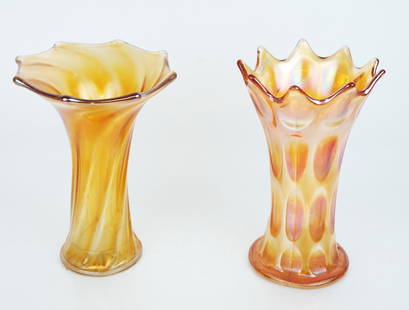 Two Carnival / Depression Glass Funeral Vases: Two Carnival / Depression glass funeral vases, having pointed rims and swirl details, on orange iridescent glass with ambergina tone, in the manner of Northwood or Fenton, unmarked. [Taller: 7 3/8"