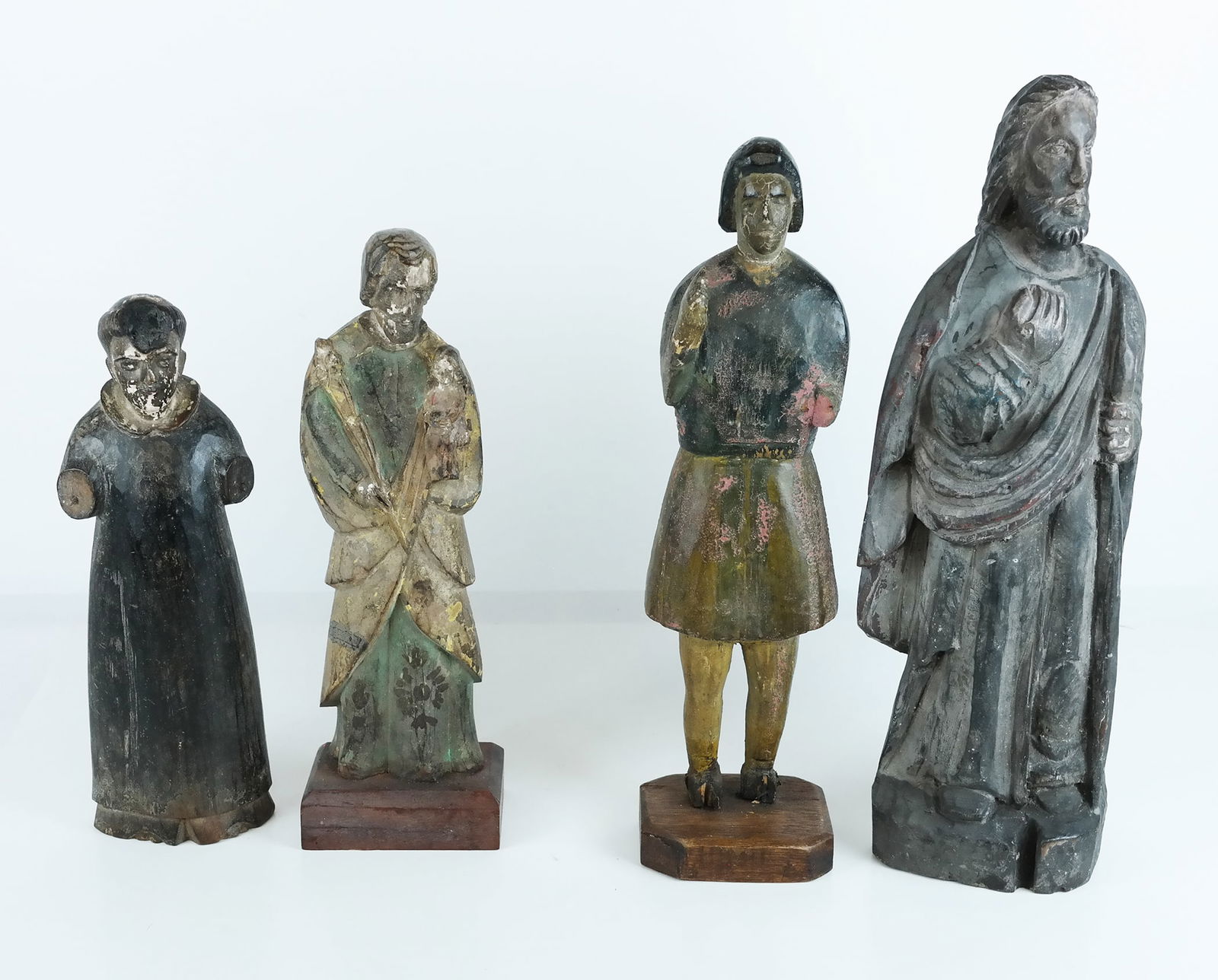 Group of Four Carved & Polychrome Santos Figures (1 of 9)