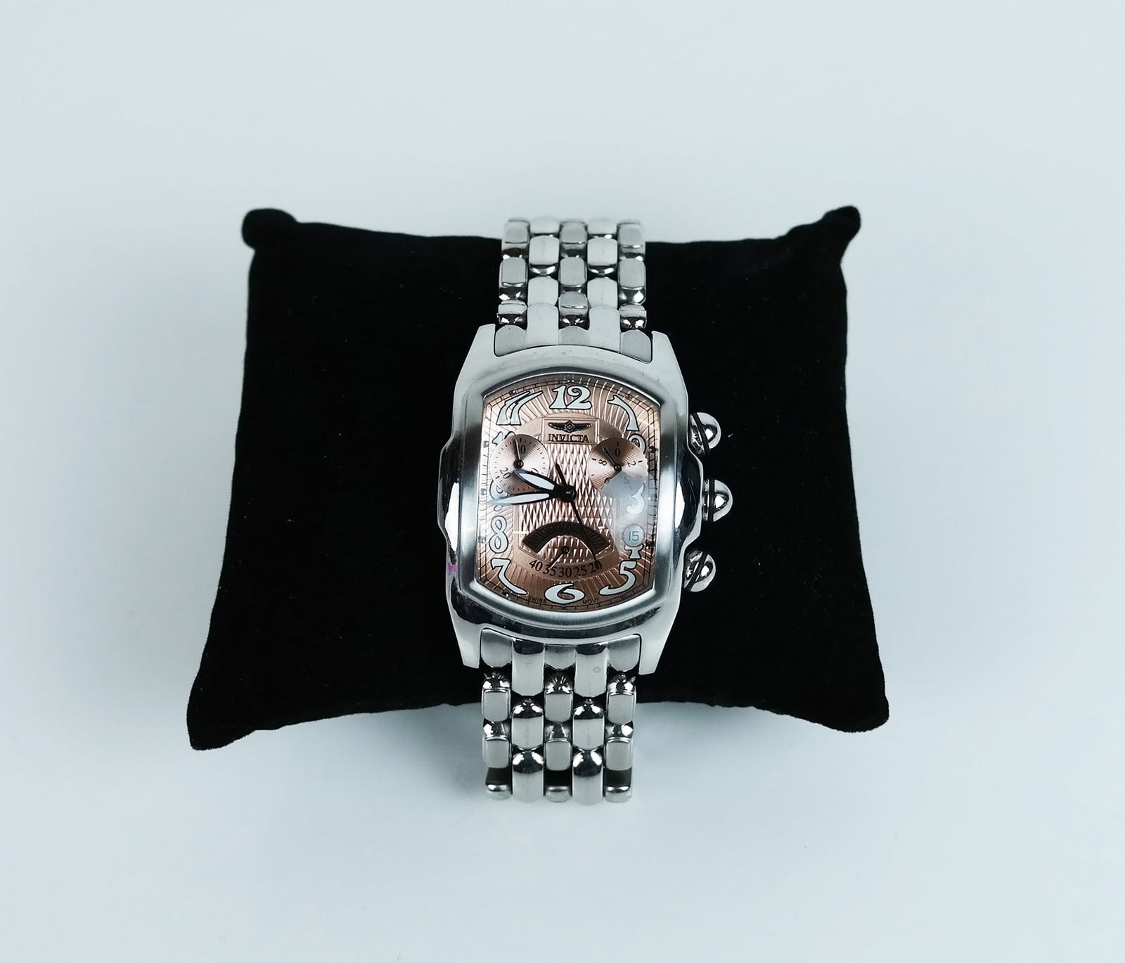 Invicta Swiss Movement Watch: Invicta Swiss movement watch, having a thick glass face, on stainless steel.