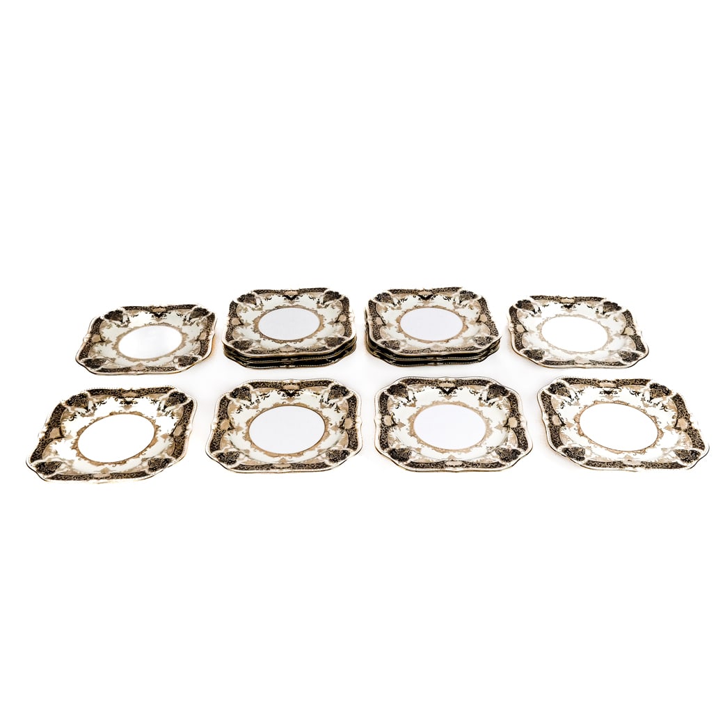 Twelve Noritake Porcelain Plates: Twelve (12) Japanese plates, in square scallop design, with cobalt blue and gold decoration. [8" X 8"].