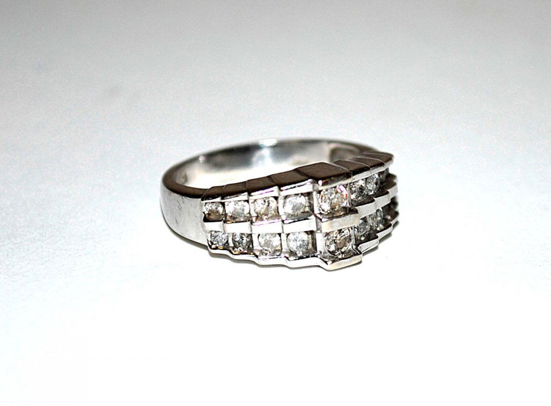 10K Gold and Diamond Ring: Art Deco setting, 18 diamonds, approx 1/2 ct. 2.1 dwt inclusive.