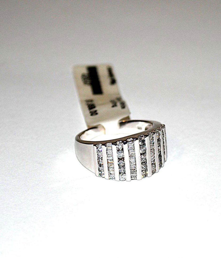 10k Gold & Diamond Ring: Bears nine bands of diamonds. 3.4 dwt inclusive.