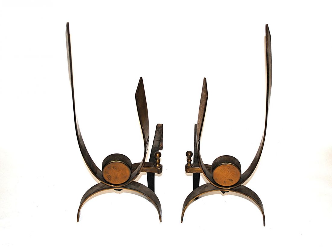 Pair of Modern Brass Andirons: Sculptural brass andirons with iron supports stamped "English Bellows" on bottom. 8 1/2" W x 17 1/2" D x 20 1/4" H.