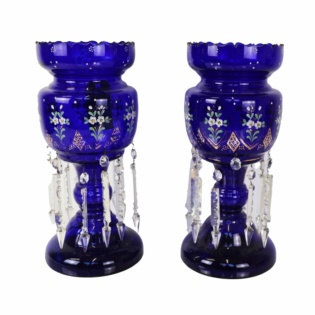 Pair Continental Painted Cobalt Blue Glass Lustres: Pair of Continental painted cobalt blue glass lustres, in the Bohemian (Czech) taste with parcel gilt "jeweled" and floral motifs, and faceted pendant prisms. [15 3/8" H x 6 1/2" Diam.]. Scuffs and we