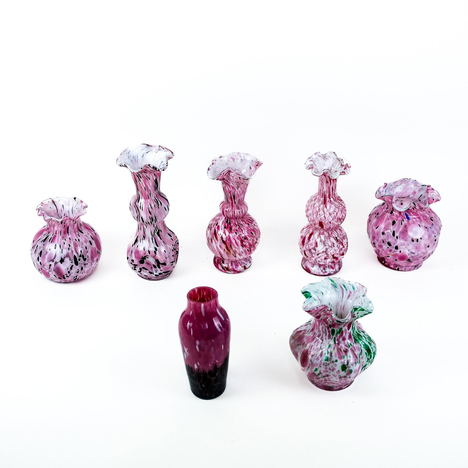 Vintage Art Glass Vessels (7): Seven vintage art glass vases, most probably Clichy French or Murano Italian with confetti splatter murine (murrina) details on pink and white ground, unsigned. [Tallest: 8 1/2" H x 4" Diam.].
