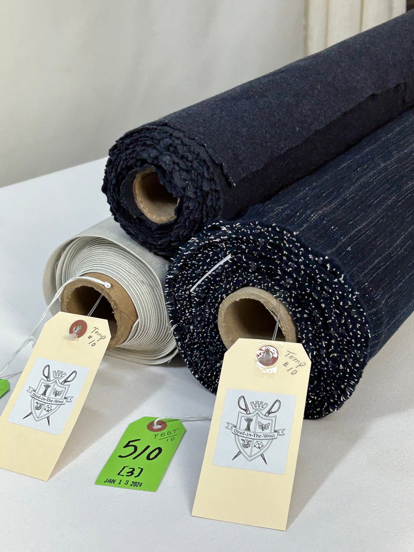Striped Faux Leather & Felted Wool Fabrics: 1) 6 1/2 yards of custom wool navy and silver lurex for a modern interior, 50" width. The wool, poly and lurex plain weave is predominantly filler faced and reads as a horizontal stripe. There are two