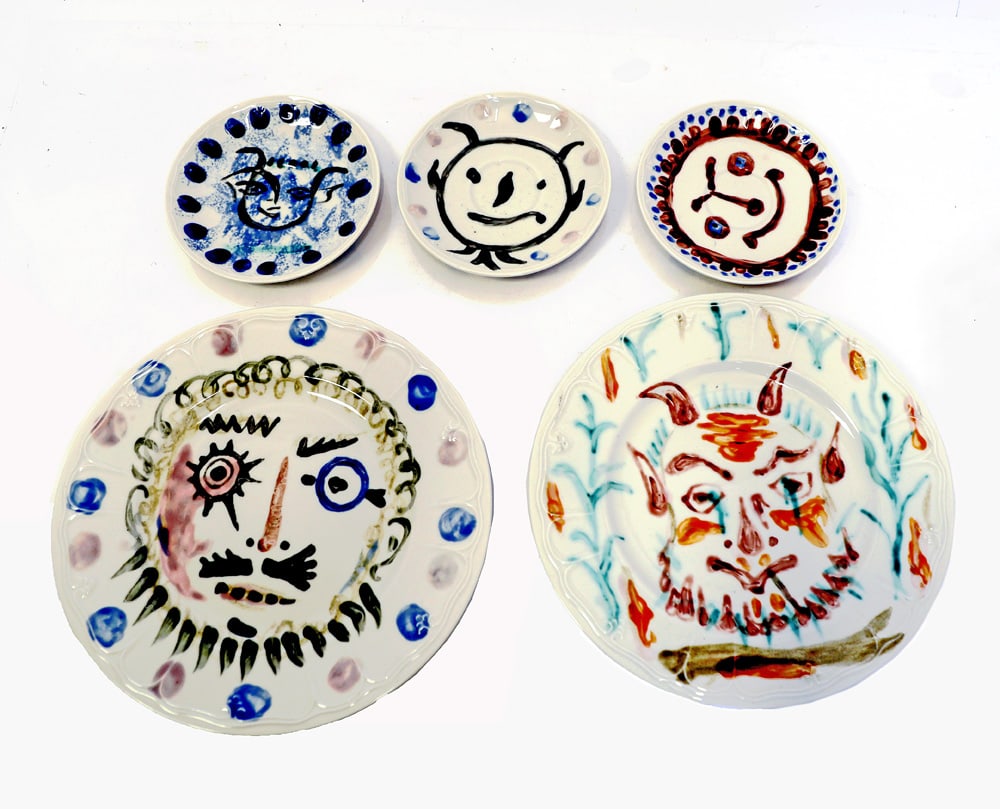 After Pablo PICASSO: Five Ceramic Dishes: Three ceramic dishes, all with painted faces, all signed verso, after Pablo Picasso. [6" Diam.]. In good condition. And Two plates, each with painted faces, signed verso, after Pablo Picasso. [11" Dia