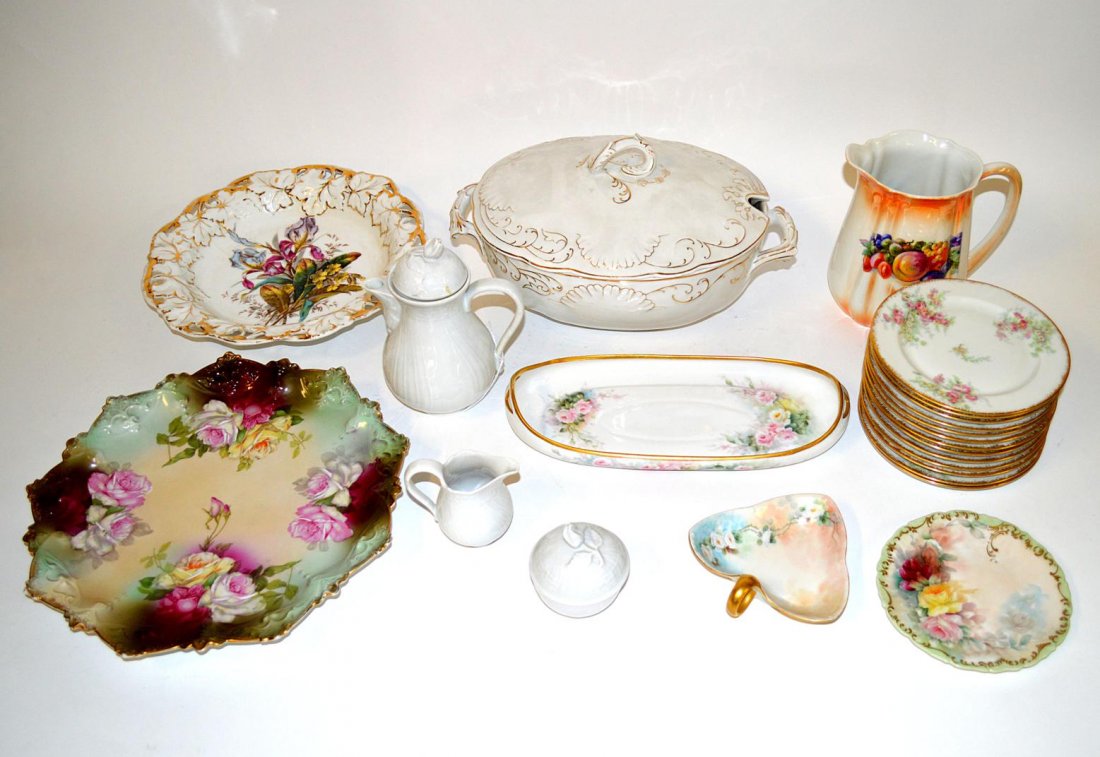 Assorted German & French Porcelain: Comprises hand-painted German & Bavarian serving dishes including chargers, trays, covered tureen, three piece tea set, and pitcher. Accompanied by a set of 13 J. Pouyat Limoges bread and butter plate