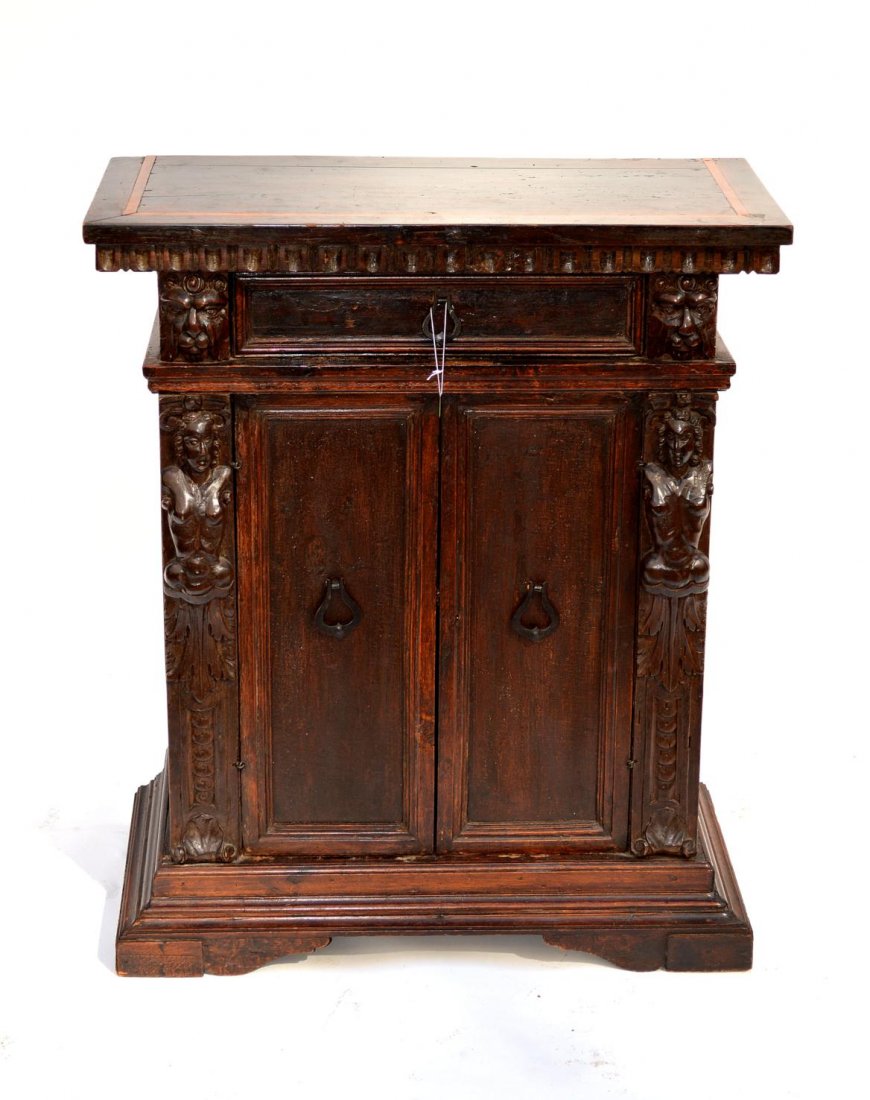 Antique Italian Renaissance Revival Cabinet: One drawer over two doors with caryatid female stiles and carved lion head accents. 28" x 13 1/2" x 32 1/4" H. Good antique condition.